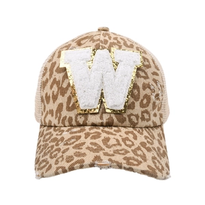 Detail of leopard print baseball cap featuring distressed brim and chenille letter W patch