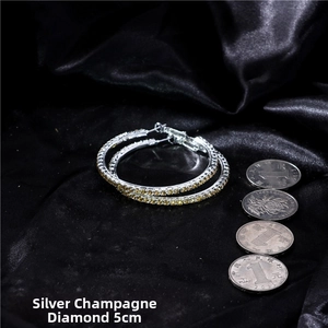 Detailed view of silver hoop earrings with champagne rhinestones and 5cm diameter