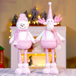 Detailed view of pink plush Christmas gnomes with sequins and telescopic legs decor