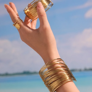 Golden multi-layer layered hollow arm cuff and sun engraved ring set for women