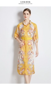 Detail of yellow floral dress with shirt collar, half sleeves and matching belt