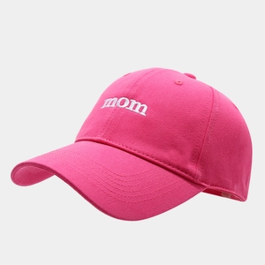 Close-up of pink baseball cap featuring white mom embroidery and cotton twill texture