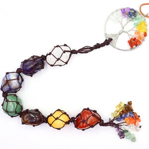 Detailed view of handmade Seven Chakras tree of life wall hanging with natural raw gemstones