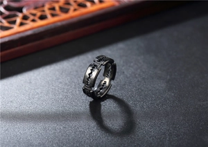 Macro shot of gunmetal titanium steel razor blade ring with sleek industrial metal texture