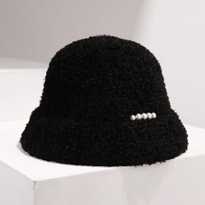 Detailed view of black plush bucket hat with thick fleece and decorative silver pearls