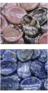 Macro detail of polished pink and blue natural crystal stones for face massage scraping