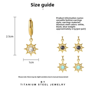 Detailed view of gold starburst earrings with natural stone inlay and size dimensions