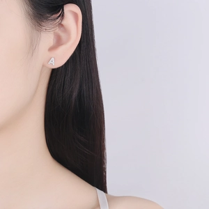 S925 sterling silver letter A stud earring with sparkling zircon on model's ear