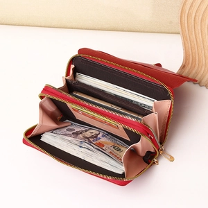 Red multi-compartment crossbody phone wallet showing organized inner storage and card slots
