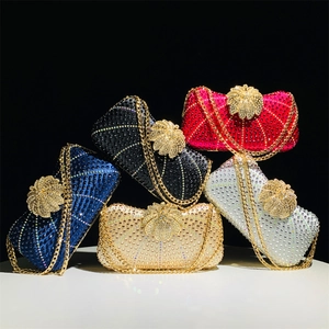 Macro shot of colorful rhinestone evening bags with sparkling floral clasps and chains