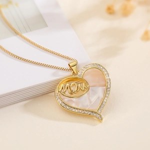 Gold-plated heart necklace featuring a mother of pearl MOM pendant with zircon accents