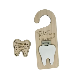 Wooden tooth fairy door hanger set with laser engraved text and a small pocket