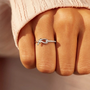 Minimalist S925 sterling silver knotted ring with fine micro-inlaid zircon for women
