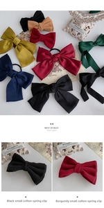 Detail of JK style oversized bow hair clips in satin and cotton fabrics for women