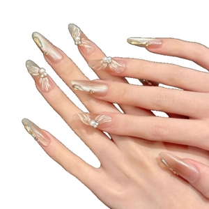 Champagne cat eye press-on nails with 3D waves, pearls and sparkling rhinestones