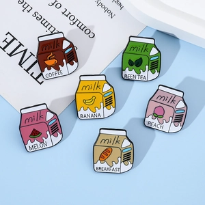 Detailed view of six colorful enamel milk box pins featuring cute fruit and coffee designs