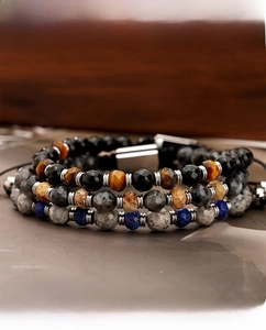 Close-up of three-layer beaded bracelet with tiger eye, lapis lazuli and metal clasp