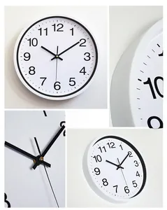 Detail view of the sleek white quartz wall clock frame and precise battery movement