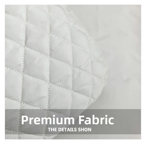 Close-up of white quilted fabric with diamond stitch pattern for oversized puffer tote bag