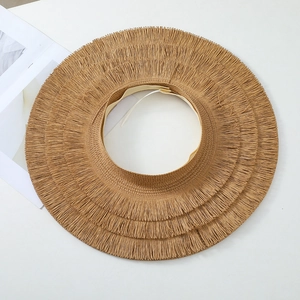 Foldable wide brim straw sun hat with fringe edges and open top design for beach