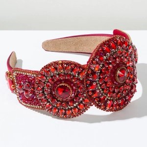Detail of luxury red rhinestone headband featuring baroque crystal embellishments