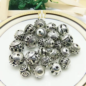 Ethnic hollow silver alloy spacer beads with floral patterns for DIY jewelry making