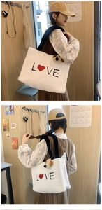 White faux fur tote bag with LOVE embroidery and cute dog plush keychain detail