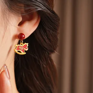 Elegant red resin rocking horse earrings with silver needles for festive luxury wear