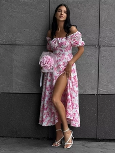 Detail view of off-shoulder floral dress with puff sleeves and side split in summer style
