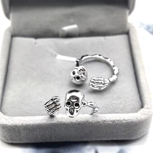 Detailed macro view of S925 sterling silver skull rings placed in a velvet jewelry box