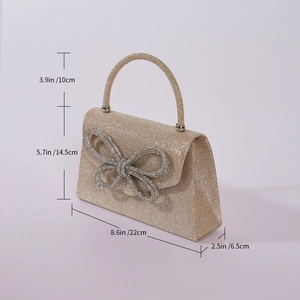 Elegant gold sequin evening bag with a bow decoration and dimensions shown in a side view