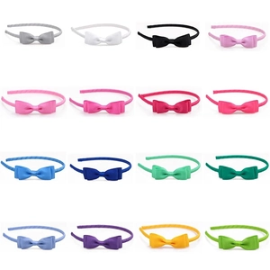 Set of 16 multicolor grosgrain ribbon bow headbands for women and girls in a 4x4 grid