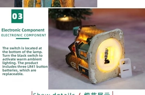Detail of Christmas resin house base showing the LED light switch and battery compartment