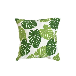 Linen cotton throw pillow cover with green monstera leaf pattern on white background