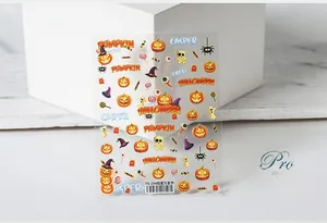 Detailed view of TS-194 Halloween 5D nail stickers featuring orange pumpkin and ghost designs