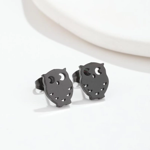 Detailed view of the cute black owl stud earrings with a minimalist hollowed-out design