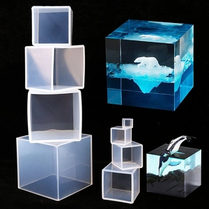 Translucent cube silicone mold set for DIY resin art with clear finished specimens
