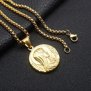 Detail of gold-plated stainless steel round pendant with Greek mythology relief and engraving