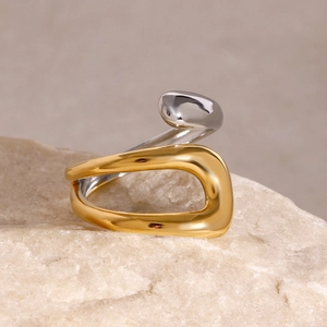 Minimalist 18k gold and silver two-tone open ring with an abstract organic design