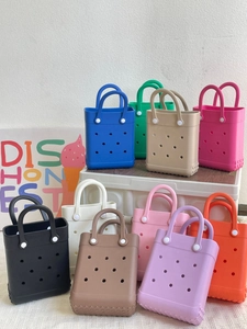 Multi-color lightweight EVA beach tote bags with iconic perforated holes displayed on shelves