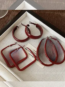 Three pairs of burgundy geometric earrings in circle square and oval glossy lacquer finish