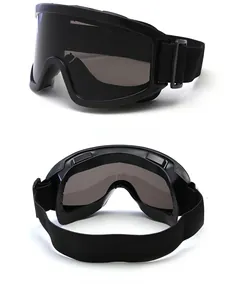 Detail of black ski goggles with adjustable elastic strap and ventilation slots
