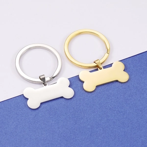 Polished gold and silver bone-shaped metal pendants for custom pet ID tag engraving
