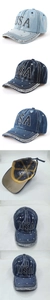 Detail of washed denim baseball cap with rhinestone USA letters and silver stud accents