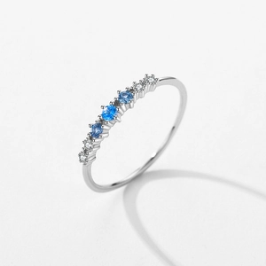 Delicate S925 sterling silver ring with micro-paved blue gemstones and clear zircons