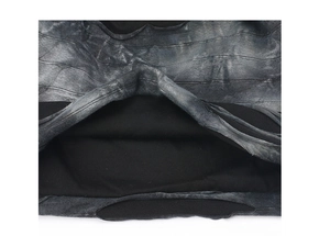 Detailed macro view of the tie-dye gray texture fabric with thick black fleece lining