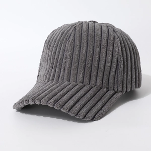 Detailed view of dark grey corduroy baseball cap texture and warm winter fabric material