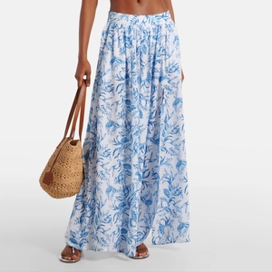 Detailed view of high-waist maxi skirt featuring fresh blue tropical leaf prints on white fabric