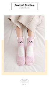 Detailed view of pink coral fleece cat socks with 3D ears and embroidery details
