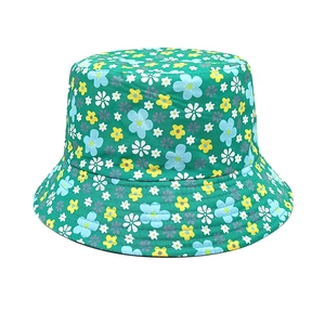 Detailed close-up of dark green floral bucket hat with yellow and blue flower patterns